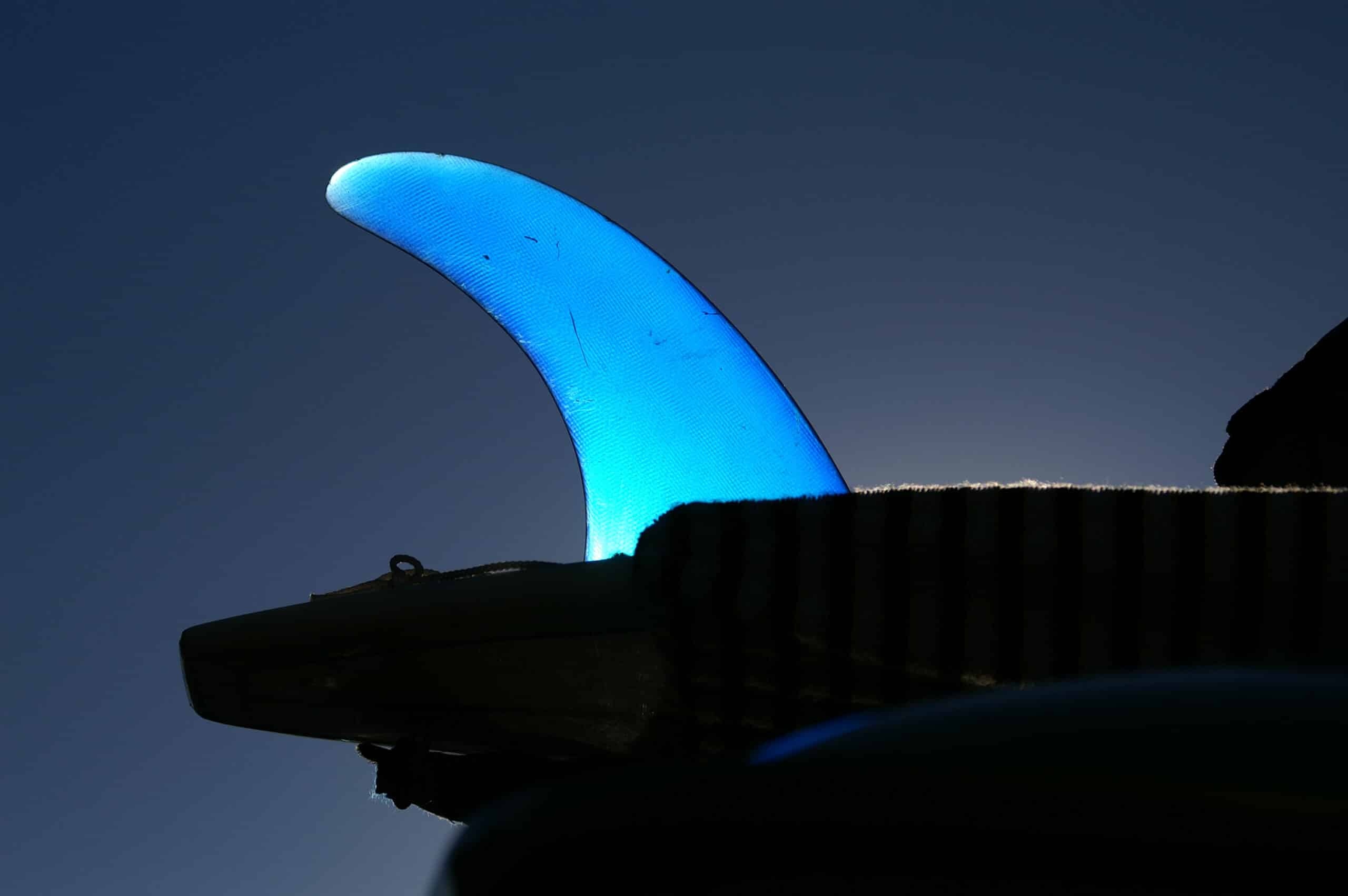 Shapers-Club- A blue light on a surfboard. -surfshop-surfboard