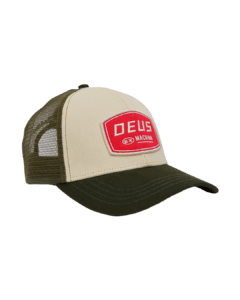 Shapers-Club- Introducing the Deus cap - PASSENGER TRUCKER: a beige and olive green trucker cap with a mesh back. The front panel features a rectangular red patch with the white text "DEUS EX MACHINA". Designed for maximum comfort, this trucker cap features a curved brim and an adjustable strap at the back. -surfshop-surfboard