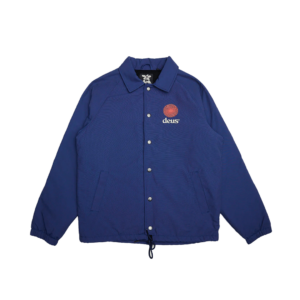 Shapers-Club- The blue DEUS - STRATA trainer jacket features a snap-front, fold-down collar and long sleeves. It is embroidered with the word "DEUS" and a distinctive red sun symbol on the chest. This jacket also features two front pockets and an adjustable drawstring hem, making it perfect for layering while effortlessly combining style and versatility. -surfshop-surfboard
