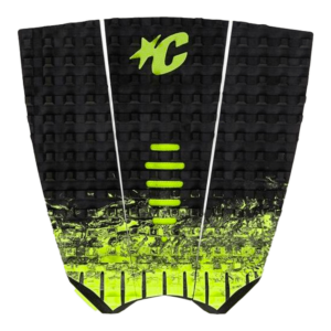 Shapers-Club- Presentation of the PAD - MINI - MICK FANNING: this traction mat features a striking design with neon black and green colors. It features a textured pattern with horizontal grooves for extra grip and a distinctive embossed logo on top. The bright green transforms smoothly into black towards the bottom, offering both style and performance. -surfshop-surfboard