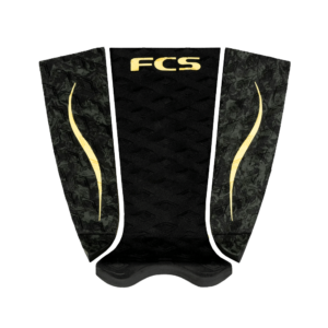 Shapers-Club- The FCS ECO TRACTION PAD C MOORE is a black surfboard traction pad adorned with textured details and the initials "FCS" in bright yellow on the top. Designed with side panels featuring a subtle pattern of curved yellow lines, this product is inspired by C Moore's dynamic style. -surfshop-surfboard